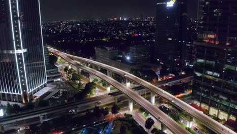 Corporate-Office-Around-The-Highways-With-Vehicles-At-Night-In-Jakarta,-Indonesia