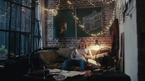 man reading in cozy apartment
