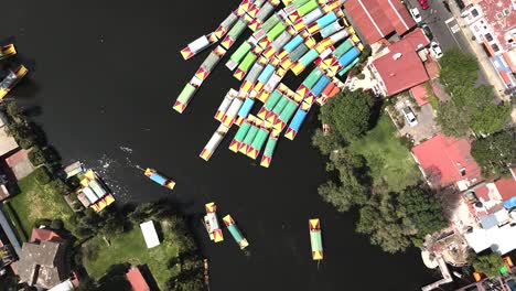 drone soaring above xochimilco dockside zone in mexico city