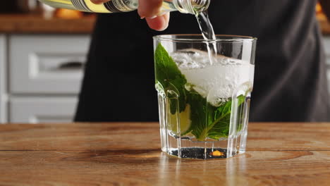 making a refreshing mojito cocktail
