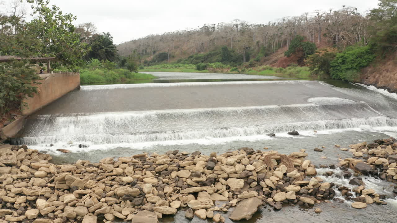 Traveling back over a river, dam on a river in Angola, Africa