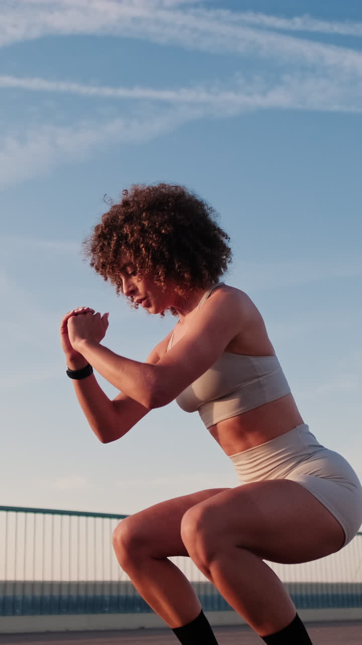Young Woman Doing Squats on Bridge