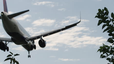 airplane passes overhead on approach to landing