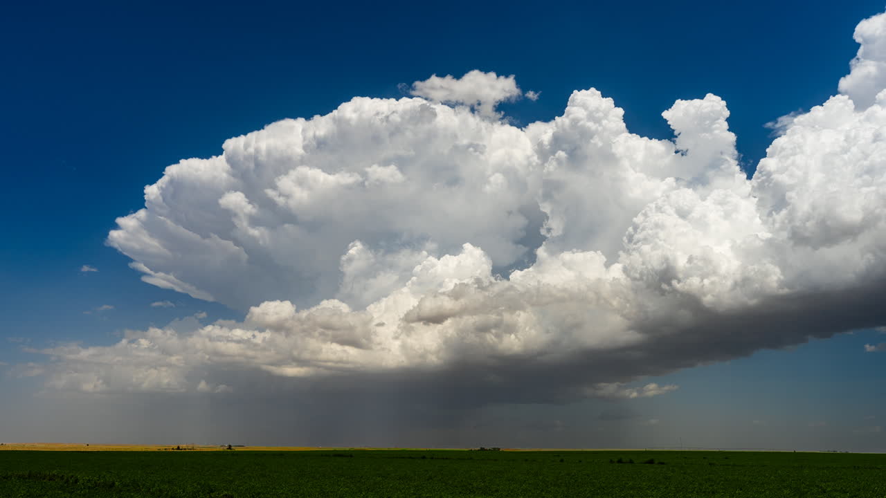 Big storm clouds developing and bursting into the atmosphere