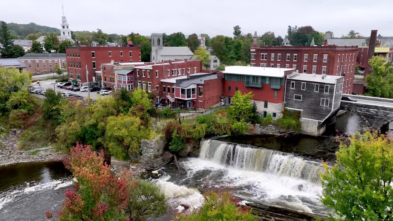 aerial push into middlebury vermont with autumn leaves