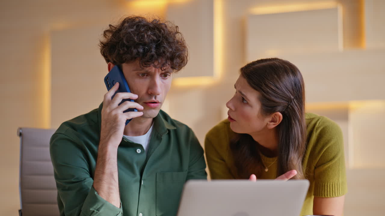 Business Team Meeting with Phone Call and Laptop