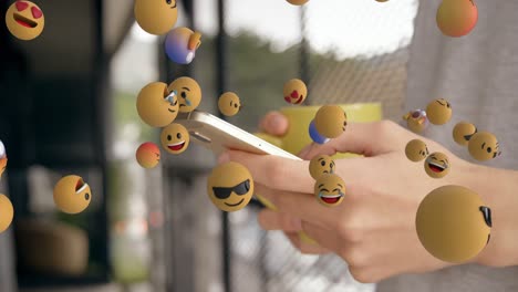 emoji-symbole mit einer frau mit smartphone im hintergrund 4k