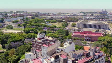 Aerial-view-of-the-green-areas-with-the-Fine-Arts-Museum-of-Buenos-Aires,-the-Law-School-of-the-University-of-Buenos-Aires-and-the-Generic-Floralis-of-the-Recoleta-neighborhood