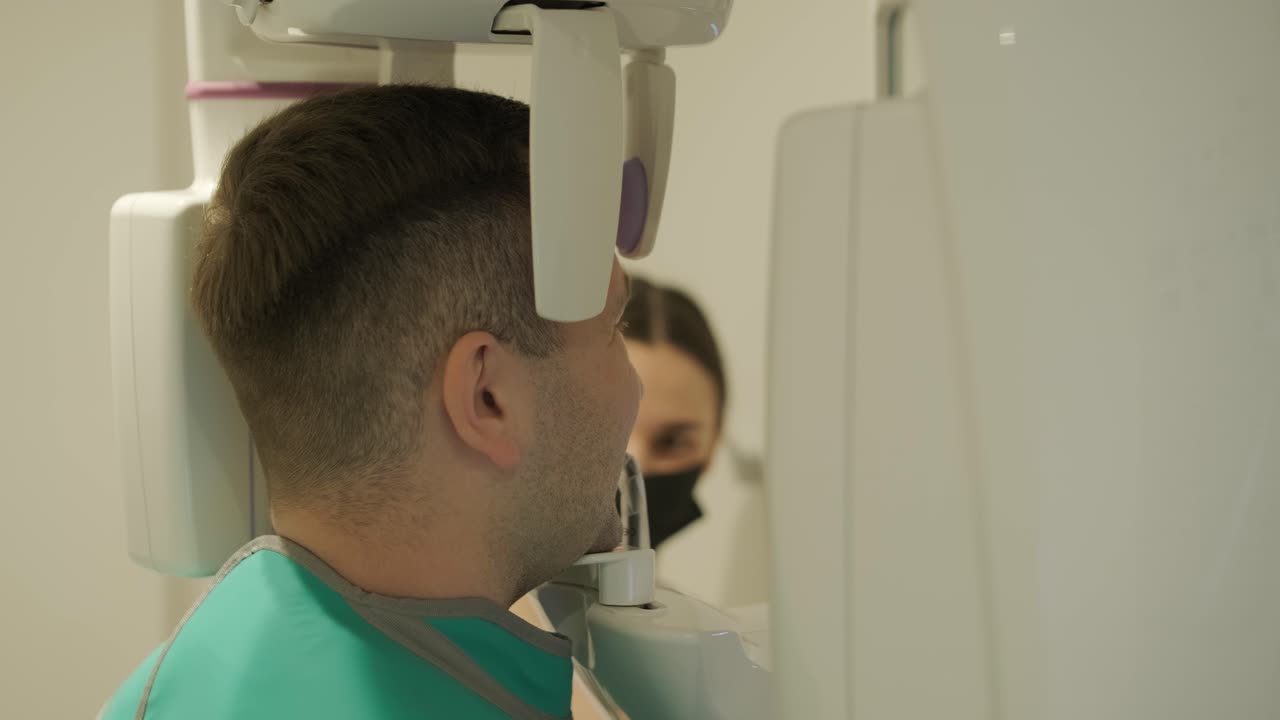 Patient Undergoing Dental X-Ray with Technician