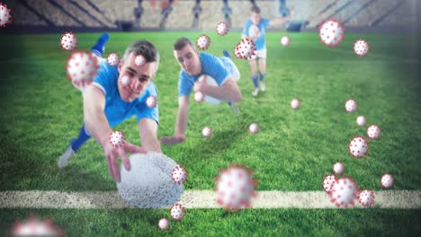 Animation-of-virus-cells-over-caucasian-male-rugby-players-at-stadium