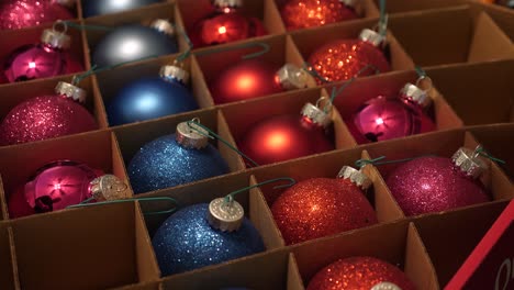 Person-Selecting-Christmas-Ornaments-to-Put-on-the-Tree-Close-Up