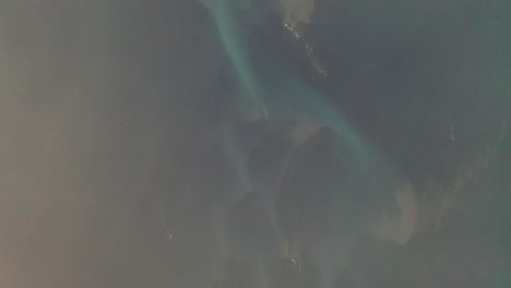 Flying-Above-Clouds-With-View-Of-Blue-Glacial-Riverbed-In-South-Iceland