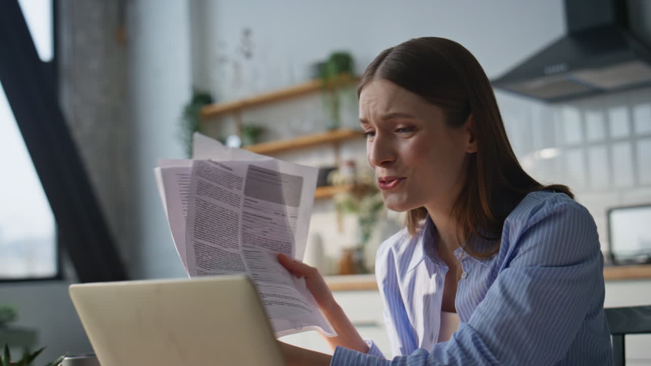Successful entrepreneur talking video meeting by laptop at home kitchen closeup