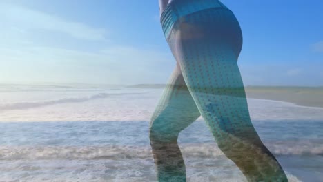 vrouw doet yoga op het strand