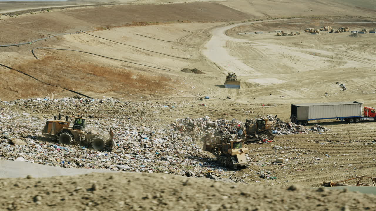 Heavy Machinery Working at a Large Landfill
