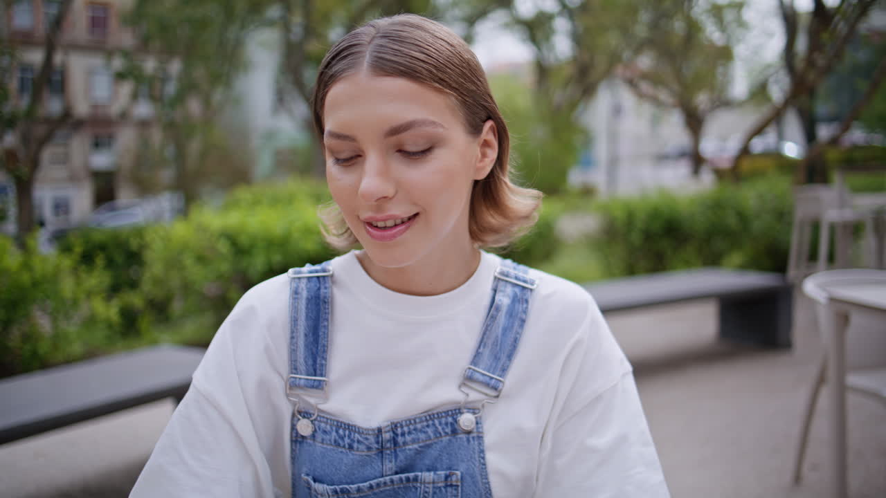 Relaxed woman drinking coffee at restaurant terrace closeup. girl