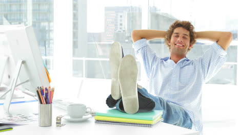 relaxed businessman reclining on his swivel chair