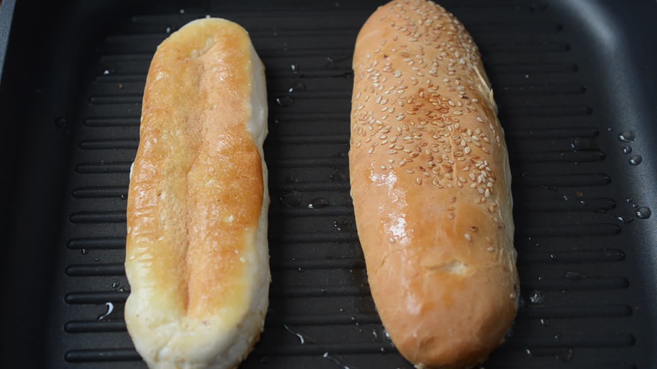 We fry sandwiches. Shooting in kitchen. Process of preparation of a dish