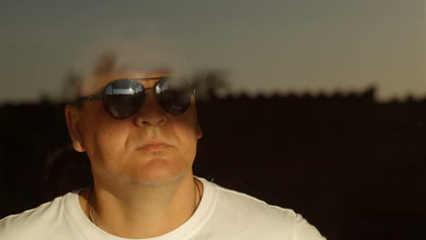 Man looking out the window