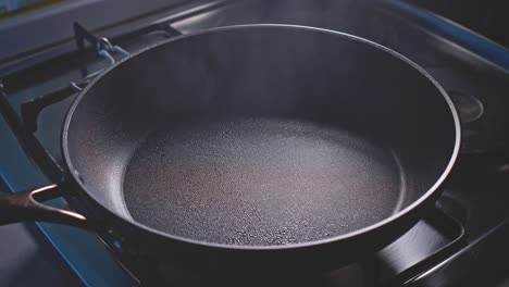 cast-iron pan sprayed with cooking oil for frying burger patties