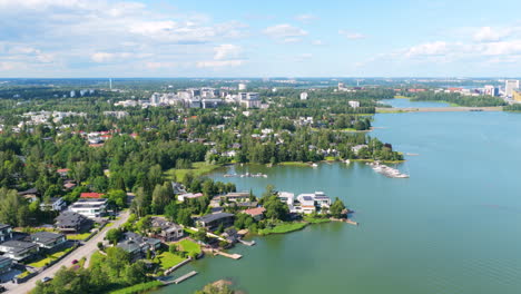 drone flying along the wealthy coastline of westend, sunny, summer day in finland