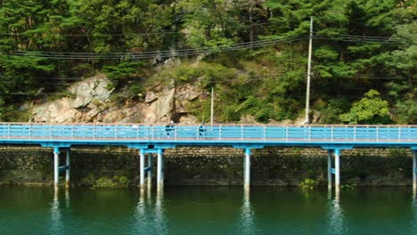 a bicycle track next to the green river