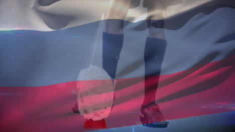 jugador de rugby pateando la pelota con una bandera rusa en el fondo