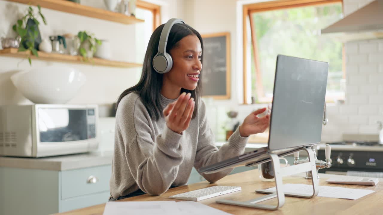 Laptop, headphones and video call with a woman