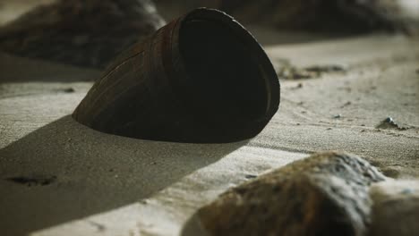 old wooden barrel on the beach