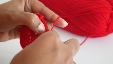 crocheting with red yarn