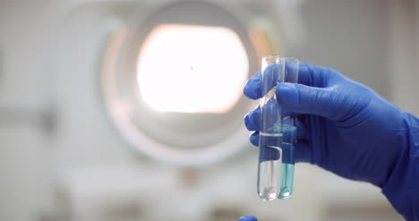 Portrait-Of-Female-Scientist-With-A-Pipette-Analyzes-A-Liquid-To-Extract-The-Dna-In-Lab-9