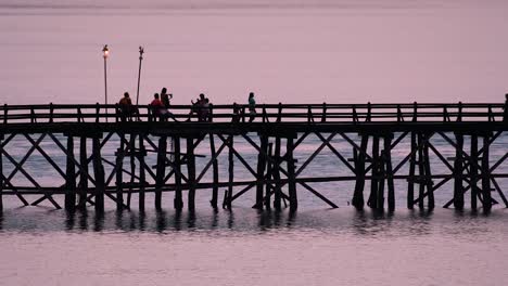 the mon bridge is an old wooden bridge located in sangkla, thailand