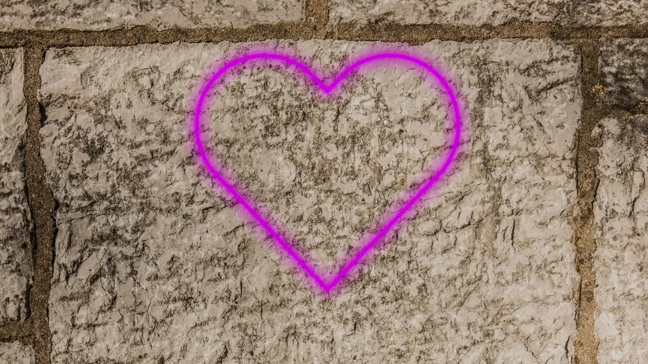 animación de un icono de corazón de neón parpadeante en una pared de ladrillo