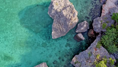 Overhead-View-Of-Boulders-At-Tropical-Shore-Of-Bahia-de-las-Aguilas,-Pedernales,-Republica-Dominicana