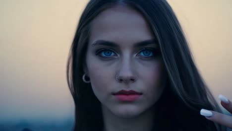 close-up portrait of a young woman with blue eyes