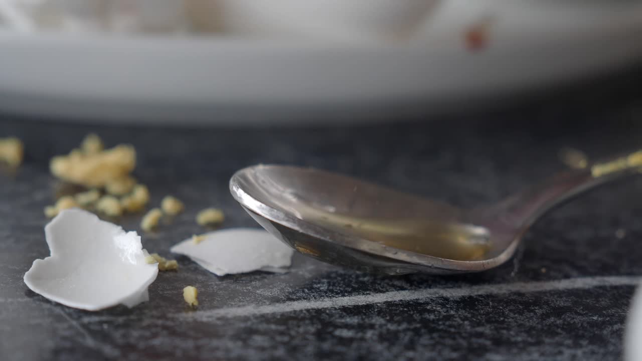 Egg Shells and Spoon on Table