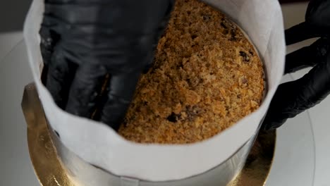 process of making cake in candy store. baker cooking cake with cream