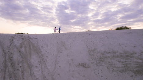 couple on top of a dune