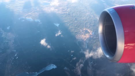 turbine view from an airplane flying above a city near the sea in europe