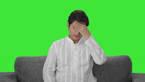 indian man taking medicine in headache green screen