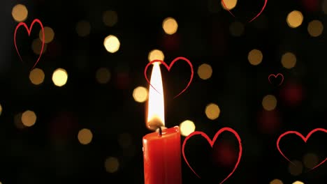 Animation-of-hearts-over-spots-and-candle