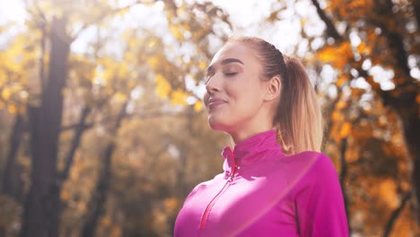 happy woman enjoying autumn park