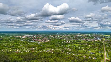 latvia cityscape and green nature surroundings, aerial hyper lapse view