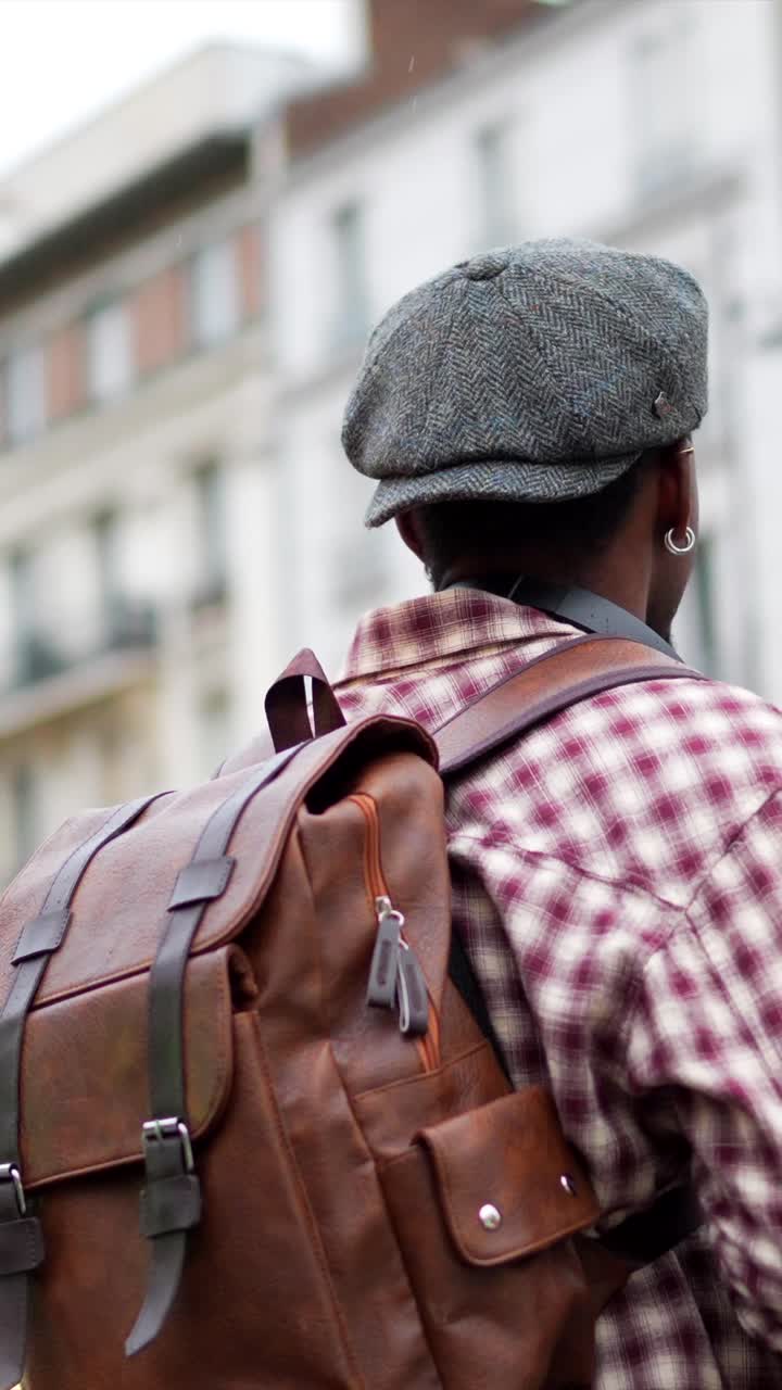 Portrait of a man with headphones and a hat