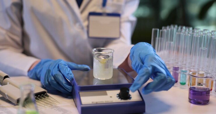 Chemist uses vibrator to stir oil and water in research lab