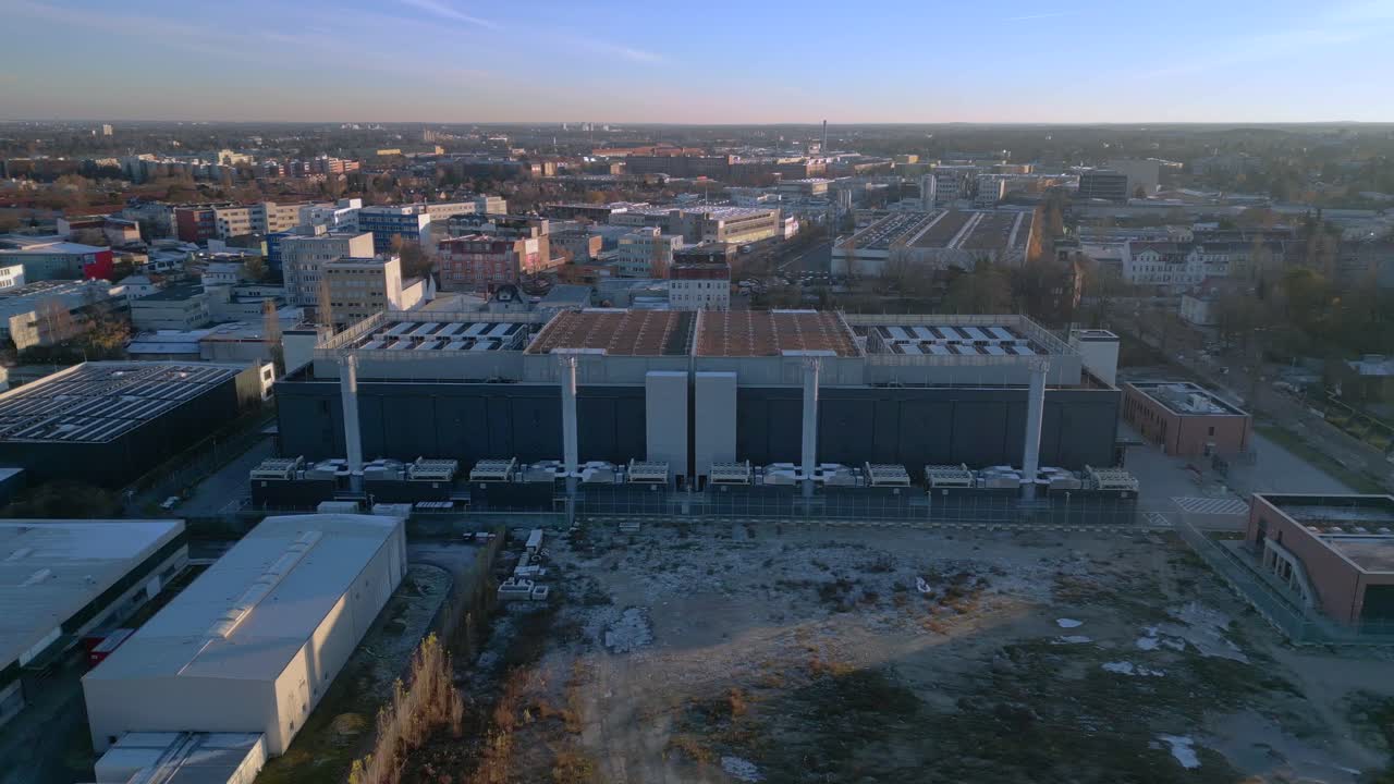 Large big data center building with advanced cooling systems, providing digital infrastructure in a city Berlin. Best aerial view panorama overview drone