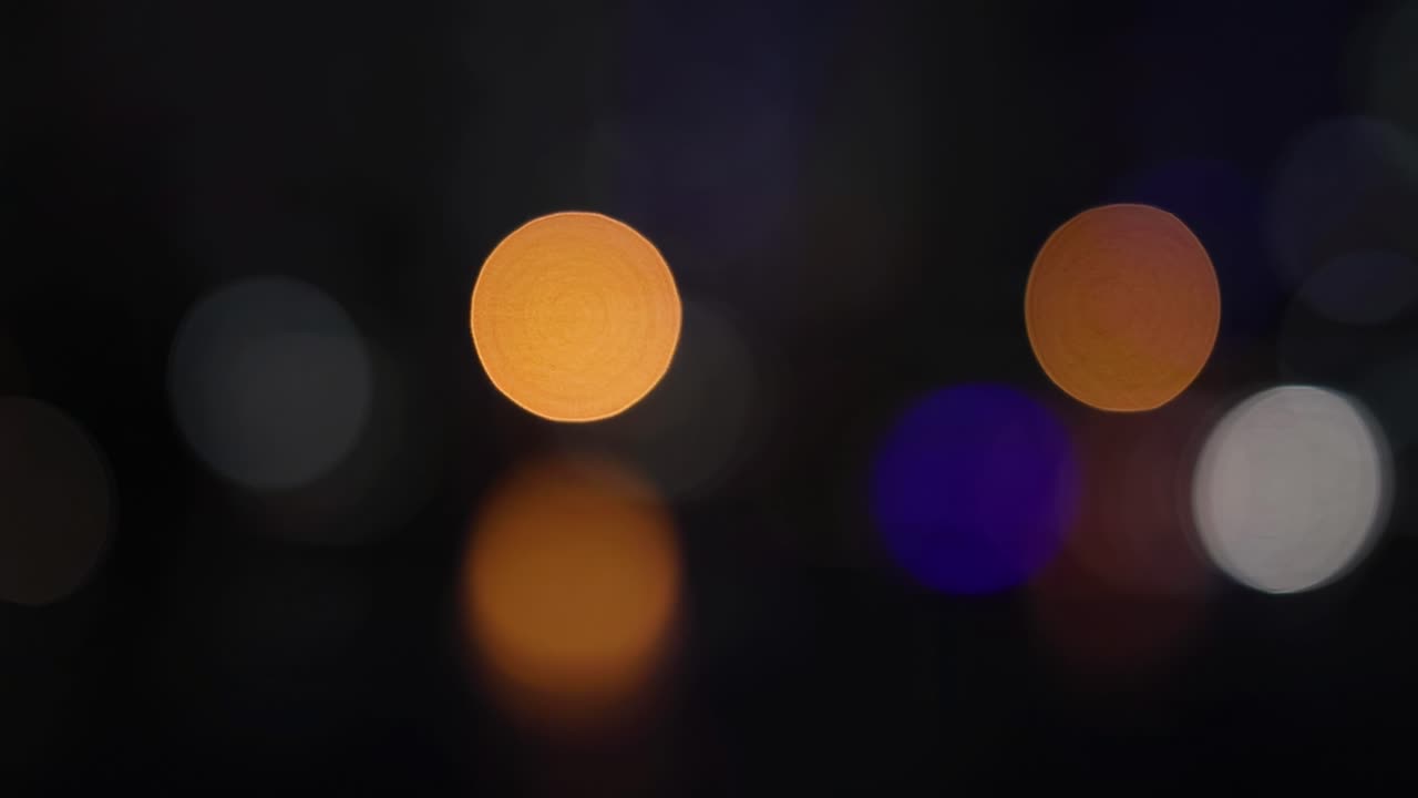 A captivating display of blurred orange and blue lights creating a serene bokeh effect.