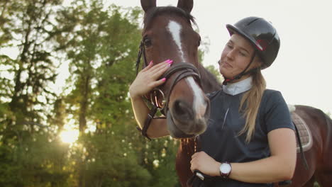 It's-unforgettable-moments-with-a-darling-horse.-Female-is-stroking-her-brown-horse-when-they-walk-together.-These-are-amazing-feelings-and-sincere-smile.