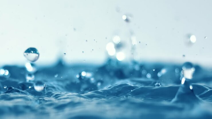 Rain water drops falling in super slow motion.