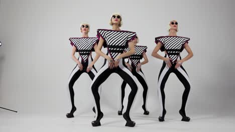 striped dancers in retro costumes